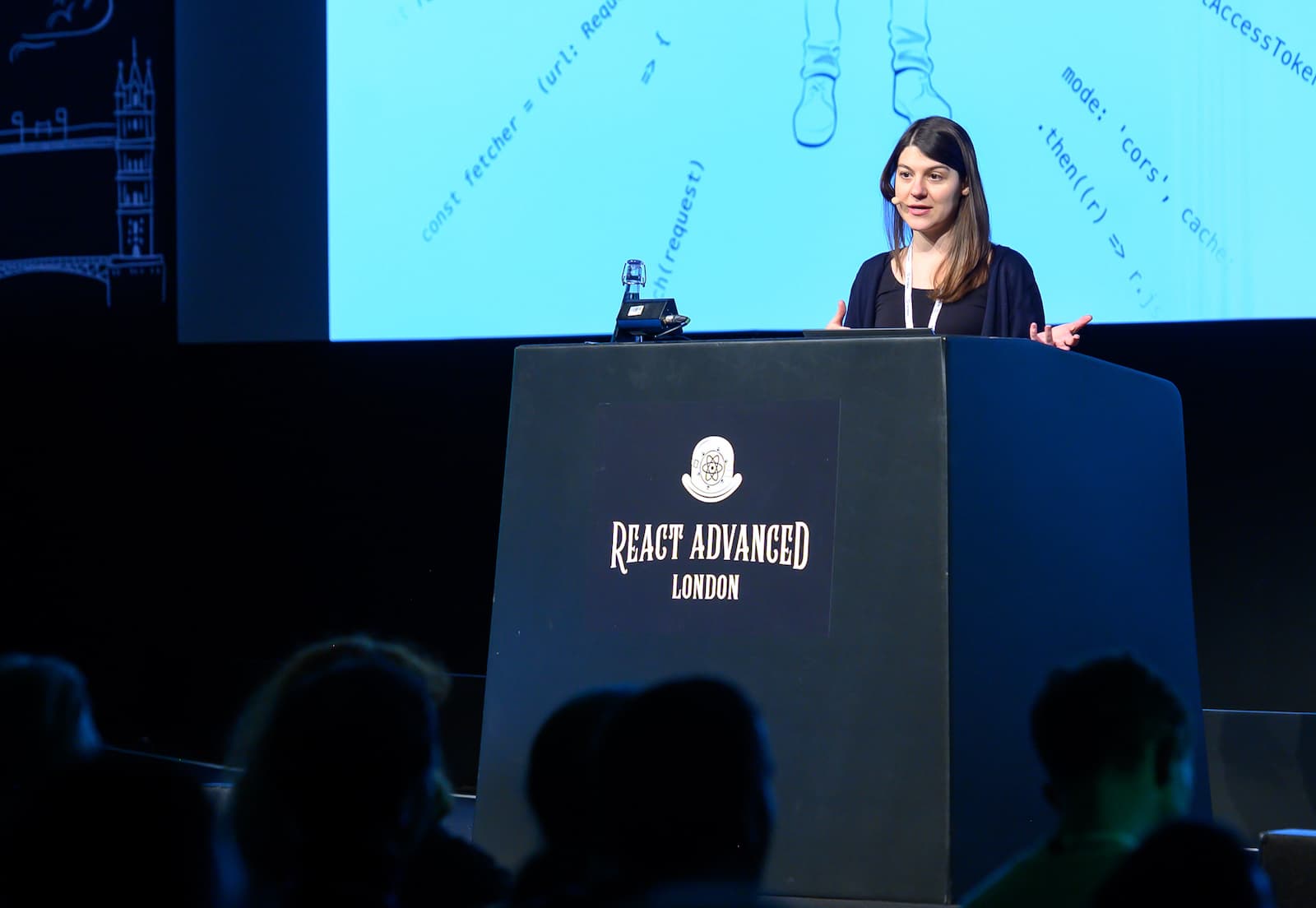 a photo of maggie speaking on stage